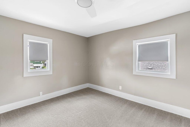 225 N Hague Ave, Columbus, OH 43204 - carpeted empty room with baseboards and ceiling fan
