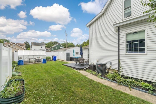 225 N Hague Ave, Columbus, OH 43204 - fenced yard featuring an outbuilding and an exterior structure