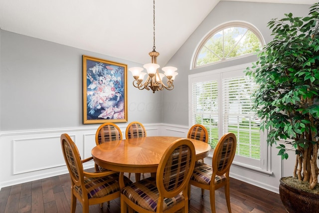 918 Dianthus Ct, Reynoldsburg, OH 43068 - dining room with wainscoting, lofted ceiling, dark wood-type flooring, a chandelier, and a decorative wall