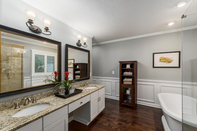 918 Dianthus Ct, Reynoldsburg, OH 43068 - full bathroom with a freestanding bath, double vanity, wood finished floors, crown molding, and a stall shower