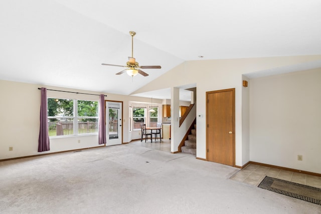 3299 Bellowind Dr, Reynoldsburg, OH 43068 - unfurnished living room featuring lofted ceiling, stairway, a ceiling fan, and light carpet