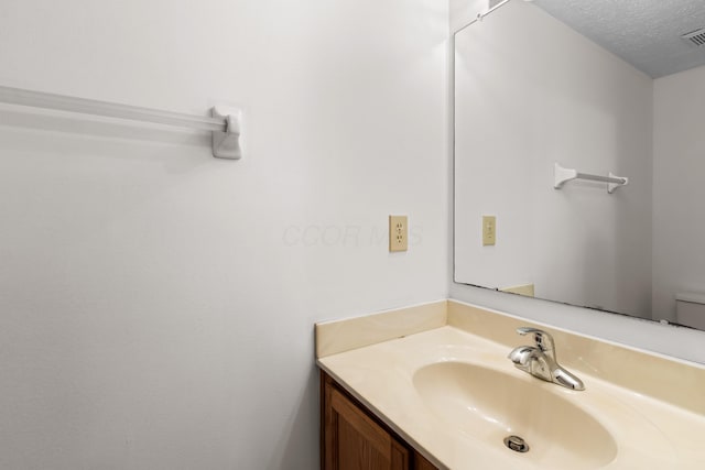 3299 Bellowind Dr, Reynoldsburg, OH 43068 - bathroom with vanity and a textured ceiling