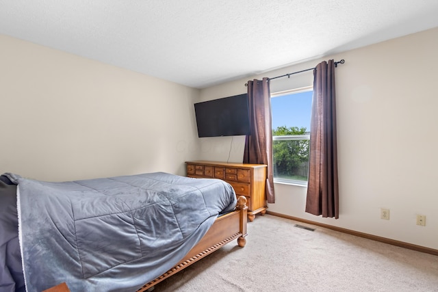 3299 Bellowind Dr, Reynoldsburg, OH 43068 - bedroom featuring light colored carpet and a textured ceiling