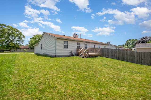 2939 Arrowsmith Dr, Reynoldsburg, OH 43068 - rear view of property with a wooden deck and a chimney