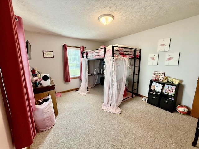 630 Duffy Dr, Washington Court House, OH 43160 - carpeted bedroom featuring a textured ceiling and baseboards