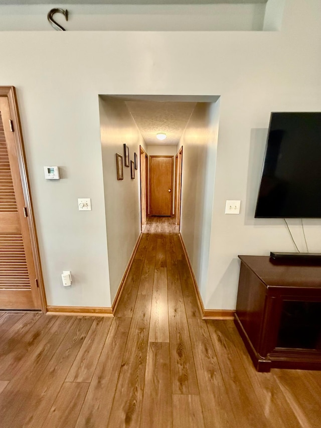 630 Duffy Dr, Washington Court House, OH 43160 - hall featuring wood-type flooring and baseboards