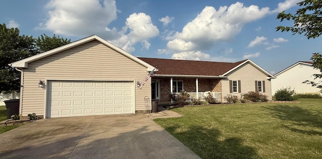 630 Duffy Dr, Washington Court House, OH 43160 - ranch-style home featuring a porch, driveway, a front yard, and a garage
