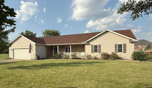 630 Duffy Dr, Washington Court House, OH 43160 - ranch-style house featuring a porch, a front yard, a garage, and concrete driveway
