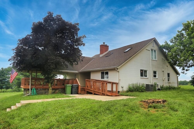 7579 Rangeline Rd, Mount Vernon, OH 43050 - rear view of property featuring a chimney, a deck, a yard, and roof with shingles