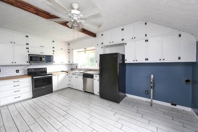 7579 Rangeline Rd, Mount Vernon, OH 43050 - kitchen with black appliances, a textured ceiling, white cabinets, a ceiling fan, and tasteful backsplash