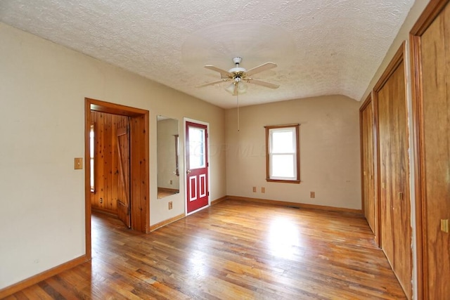 7579 Rangeline Rd, Mount Vernon, OH 43050 - empty room featuring ceiling fan, light wood-style flooring, and a textured ceiling