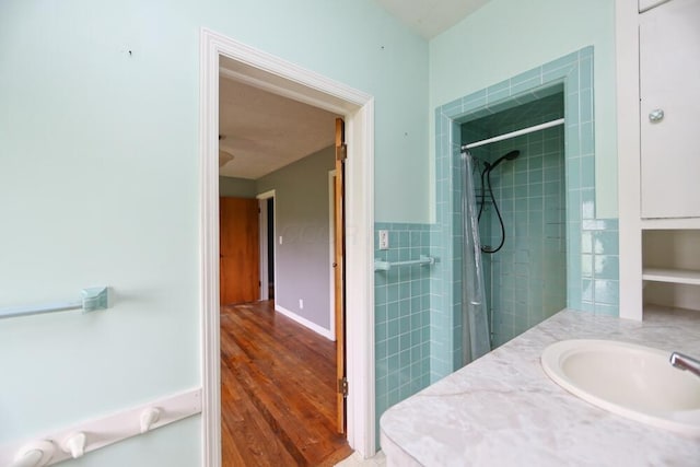 7579 Rangeline Rd, Mount Vernon, OH 43050 - full bathroom with tiled shower, wood finished floors, and vanity