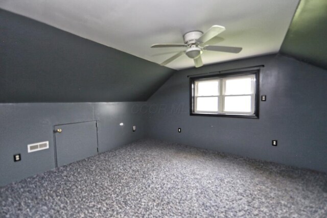 7579 Rangeline Rd, Mount Vernon, OH 43050 - bonus room with lofted ceiling, a ceiling fan, and carpet
