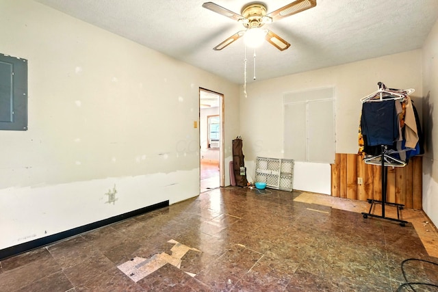 78 E St, Bellville, OH 44813 - empty room with electric panel, ceiling fan, and a textured ceiling