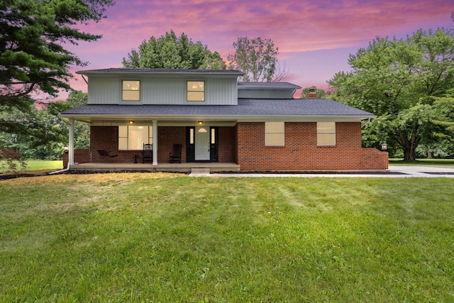 4250 Rutherford Rd, Powell, OH 43065 - traditional-style house with covered porch, a yard, brick siding, and a chimney