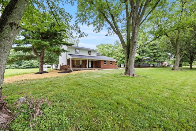 4250 Rutherford Rd, Powell, OH 43065 - view of grassy yard with a porch