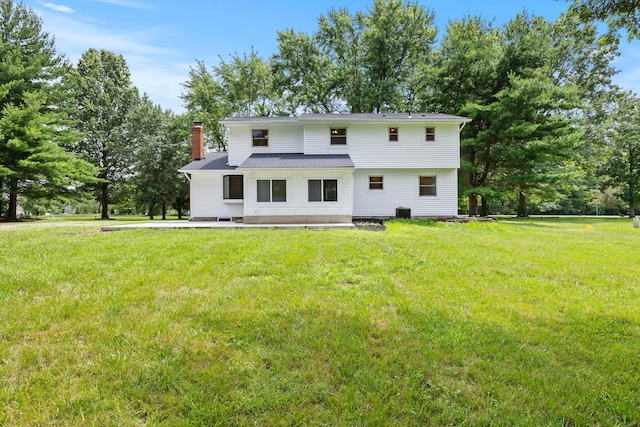 4250 Rutherford Rd, Powell, OH 43065 - back of property featuring a lawn and a chimney