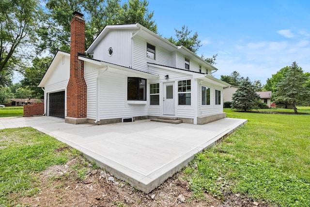 4250 Rutherford Rd, Powell, OH 43065 - back of property featuring a chimney, entry steps, a yard, a garage, and concrete driveway