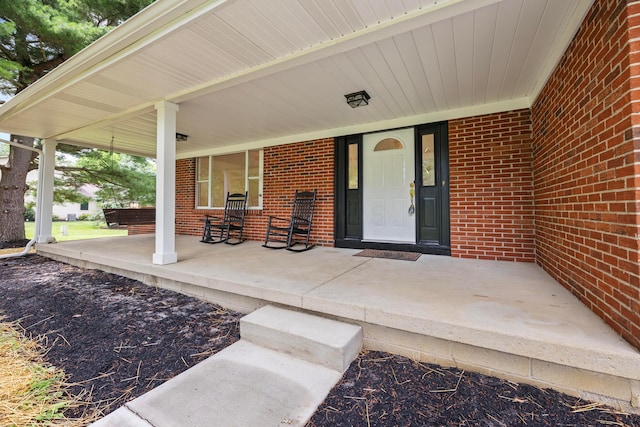 4250 Rutherford Rd, Powell, OH 43065 - doorway to property with a porch and brick siding
