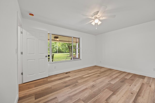 4250 Rutherford Rd, Powell, OH 43065 - empty room featuring light wood-style floors, ceiling fan, and a smoke detector