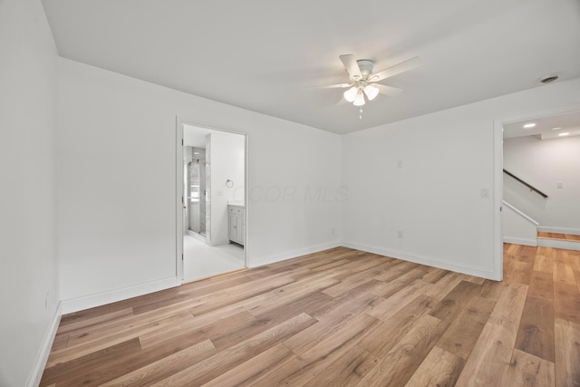 4250 Rutherford Rd, Powell, OH 43065 - spare room with a ceiling fan, light wood finished floors, and stairway