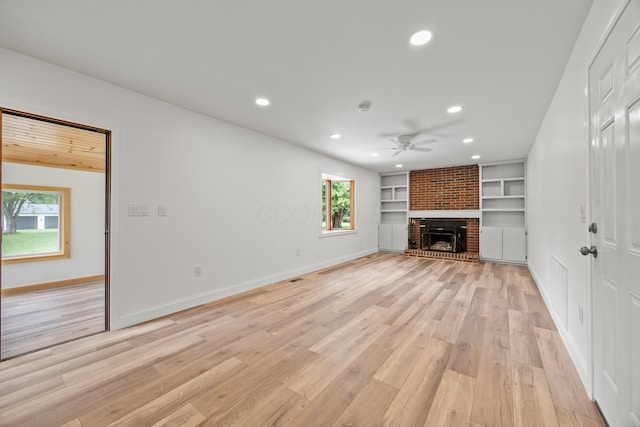 4250 Rutherford Rd, Powell, OH 43065 - unfurnished living room with a ceiling fan, light wood-type flooring, recessed lighting, a fireplace, and built in features