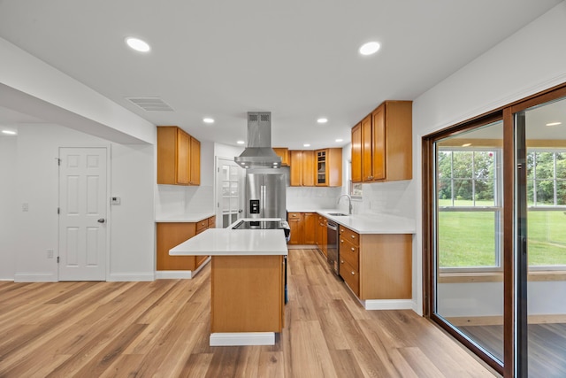 4250 Rutherford Rd, Powell, OH 43065 - kitchen featuring island exhaust hood, stainless steel appliances, light wood-style flooring, brown cabinets, and recessed lighting
