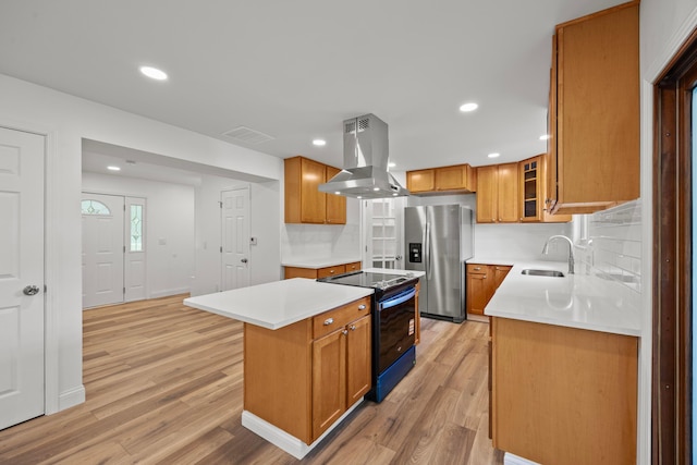4250 Rutherford Rd, Powell, OH 43065 - kitchen with island range hood, electric stove, stainless steel fridge, light wood-type flooring, and a center island