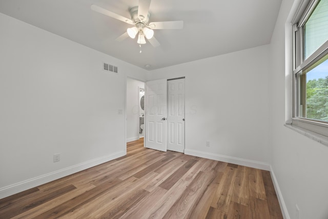 4250 Rutherford Rd, Powell, OH 43065 - unfurnished bedroom featuring light wood finished floors, a ceiling fan, and a closet
