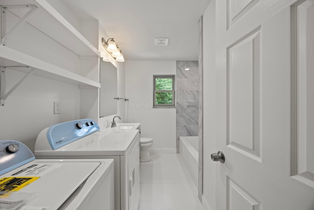 4250 Rutherford Rd, Powell, OH 43065 - laundry room featuring washer and clothes dryer and light tile patterned flooring