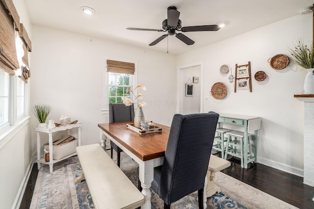 3445 Woodlawn Ave, Grove City, OH 43123 - dining space featuring wood finished floors, a fireplace, and a ceiling fan
