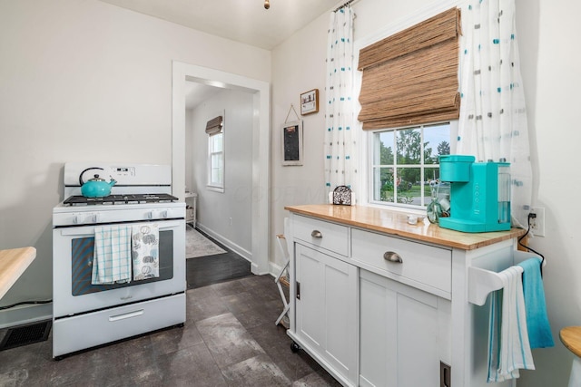 3445 Woodlawn Ave, Grove City, OH 43123 - kitchen featuring white gas range oven, wooden counters, and white cabinetry