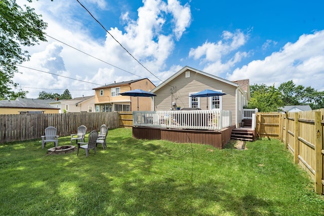 3445 Woodlawn Ave, Grove City, OH 43123 - rear view of house with an outdoor fire pit, a fenced backyard, and a wooden deck