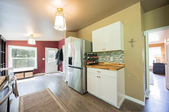 13399 Staddens Bridge Rd SE, Heath, OH 43056 - kitchen with stainless steel fridge, wood counters, dark wood-style flooring, tasteful backsplash, and white cabinetry