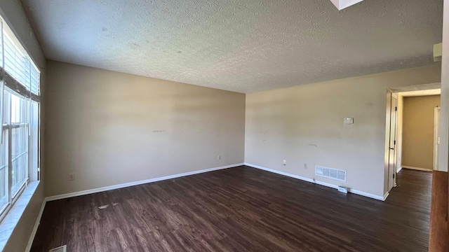 7831 Fairfax Loop Dr, Blacklick, OH 43004 - spare room with dark wood-type flooring and a textured ceiling