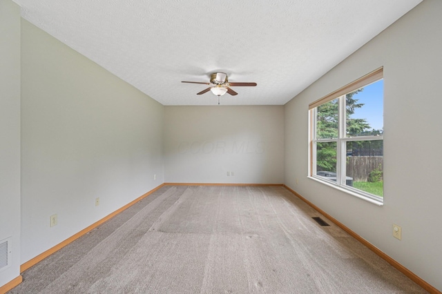 1016 Pebble Brook Dr, Columbus, OH 43240 - empty room with a ceiling fan, a textured ceiling, and light carpet
