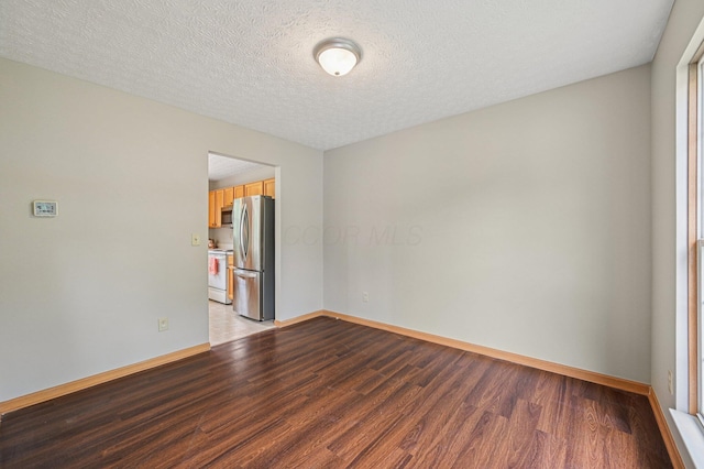 1016 Pebble Brook Dr, Columbus, OH 43240 - unfurnished room with light wood-style flooring and a textured ceiling