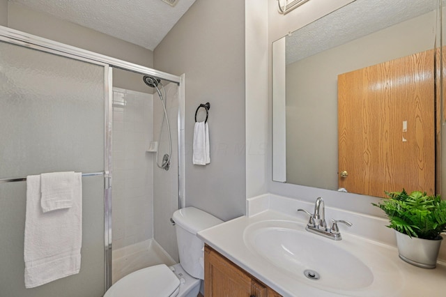 1016 Pebble Brook Dr, Columbus, OH 43240 - bathroom featuring a stall shower, vanity, and a textured ceiling