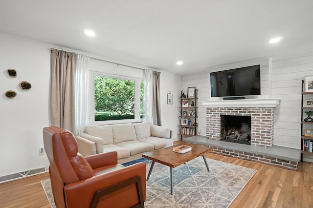 2820 Halstead Rd, Columbus, OH 43221 - living area with wood finished floors, a fireplace, and recessed lighting