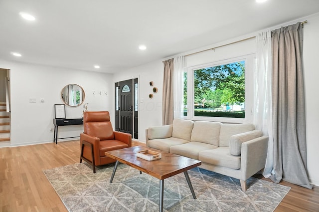2820 Halstead Rd, Columbus, OH 43221 - living room with stairs, recessed lighting, and light wood-style flooring