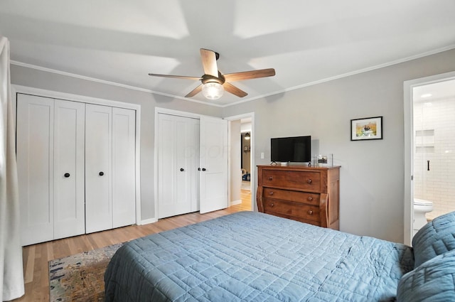 2820 Halstead Rd, Columbus, OH 43221 - bedroom with multiple closets, wood finished floors, ornamental molding, ensuite bath, and a ceiling fan