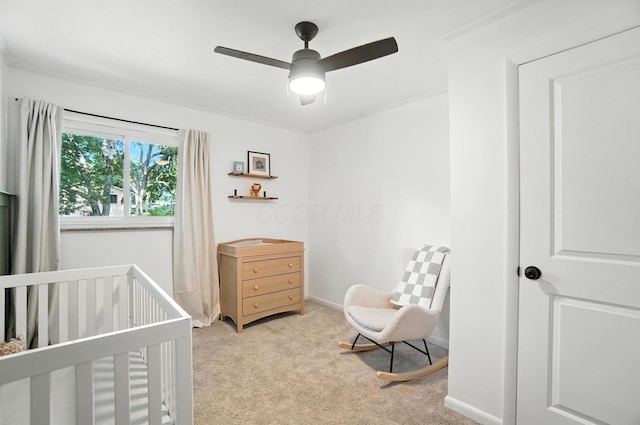 2820 Halstead Rd, Columbus, OH 43221 - carpeted bedroom featuring a crib and ceiling fan