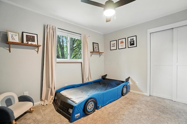 2820 Halstead Rd, Columbus, OH 43221 - carpeted bedroom featuring crown molding, a closet, and ceiling fan
