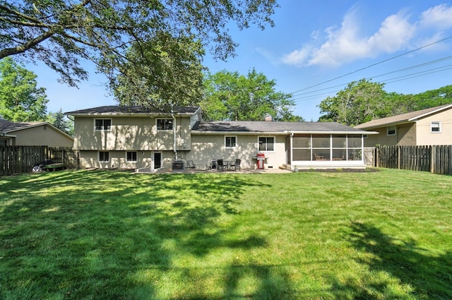2820 Halstead Rd, Columbus, OH 43221 - back of house featuring a sunroom, a fenced backyard, and a chimney