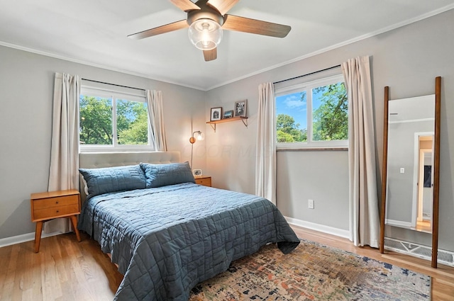 2820 Halstead Rd, Columbus, OH 43221 - bedroom with wood finished floors, ornamental molding, and ceiling fan