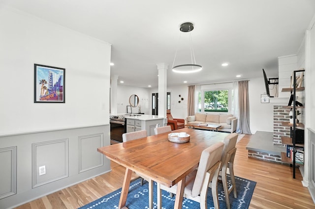 2820 Halstead Rd, Columbus, OH 43221 - dining space featuring light wood finished floors, decorative columns, and recessed lighting