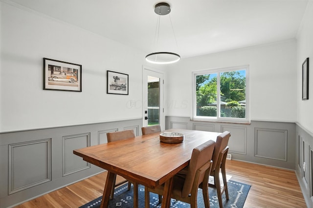 2820 Halstead Rd, Columbus, OH 43221 - dining room with a wainscoted wall, a decorative wall, and light wood finished floors