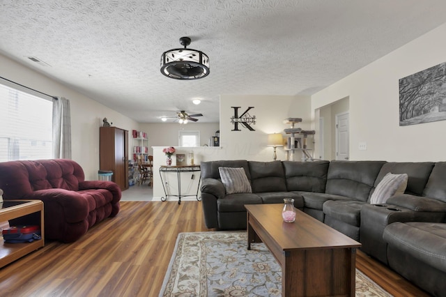 3857 Winding Twig Dr, Canal Winchester, OH 43110 - living area featuring wood finished floors, a ceiling fan, and a textured ceiling