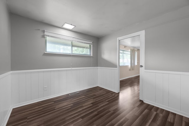 3505 Roswell Dr, Columbus, OH 43227 - spare room featuring wainscoting and dark wood-style floors