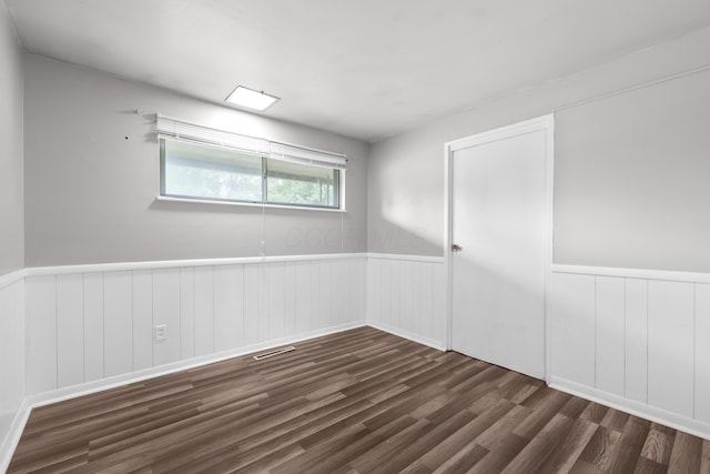 3505 Roswell Dr, Columbus, OH 43227 - spare room featuring wood finished floors and a wainscoted wall